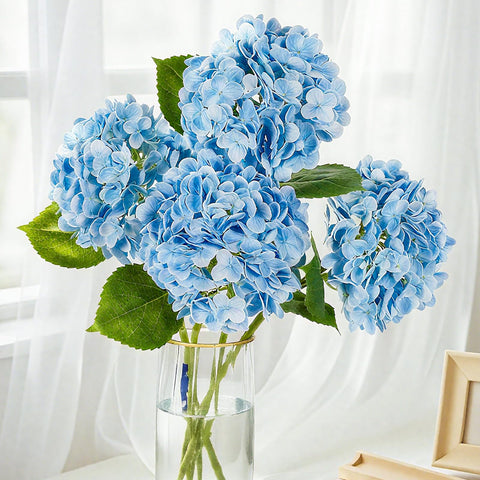 Pmyra blue hydrangea wedding table centerpiece with year-round blooms.