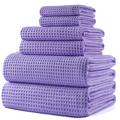 POLYTE bath towel 30x60 in waffle weave for quick drying.