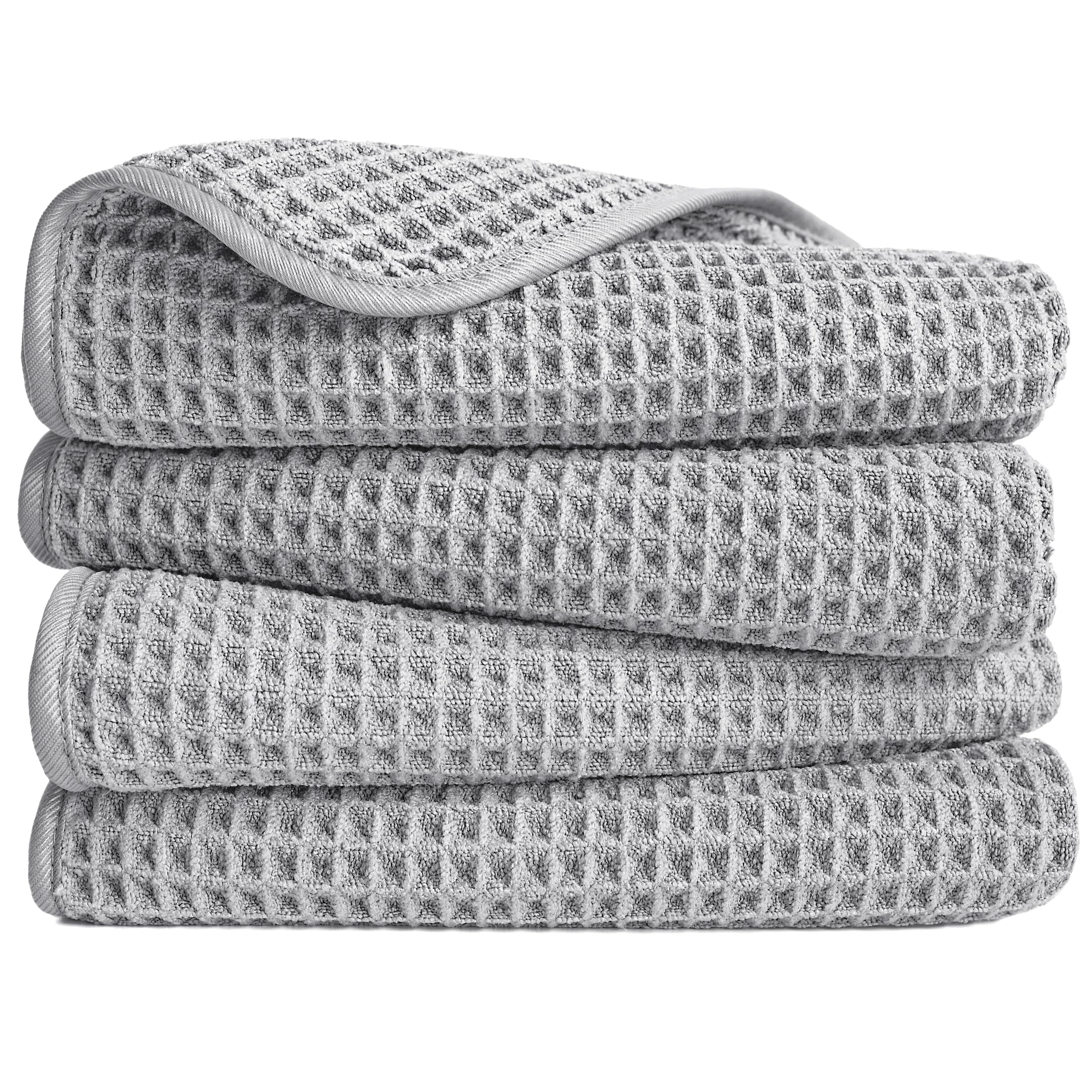 POLYTE microfiber hand towel folded to show waffle weave for quick, lint-free drying.
