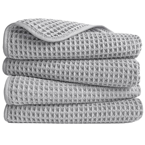 POLYTE microfiber hand towel folded to show waffle weave for quick, lint-free drying.