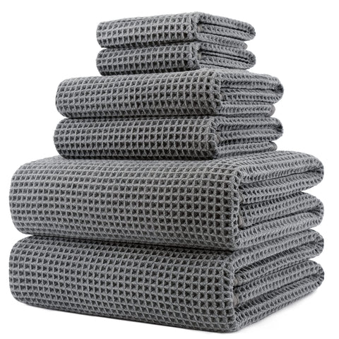 POLYTE bath towel 30x60 inches in waffle weave for quick drying and plush feel.