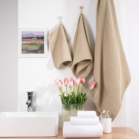 POLYTE compact-folded towels demonstrate easy storage for travel or gym.