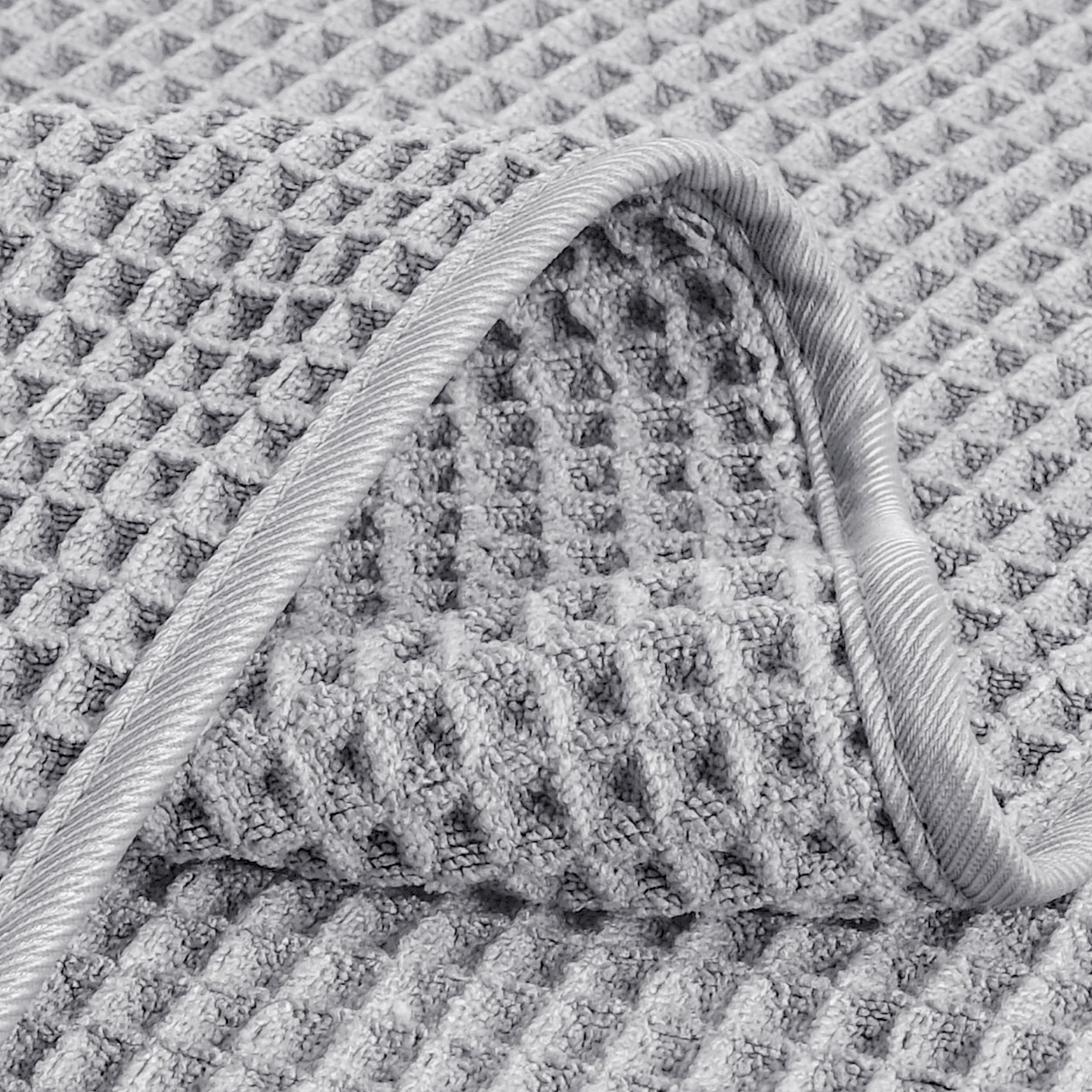POLYTE bathroom setup shows quick-dry towels ready for travel, gym, or pool.