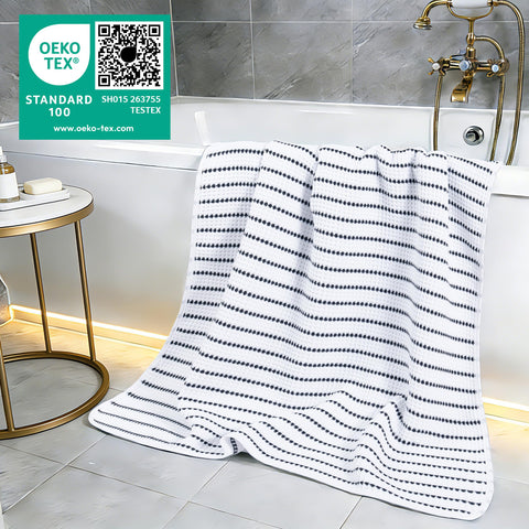 POLYTE oversized towel draped poolside for gym or travel scenarios