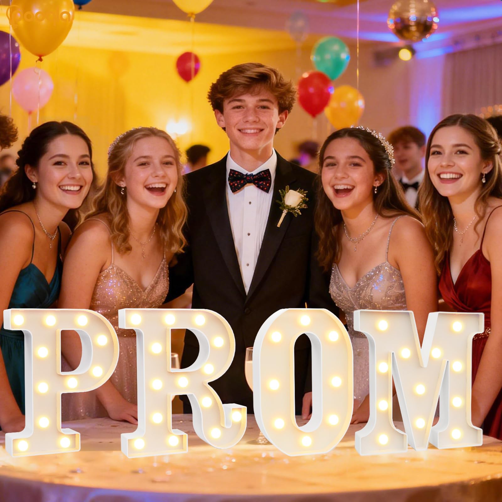 Pooqla PROM marquee letters on a table with warm white glow for graduation photo backdrop