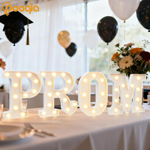 Pooqla PROM marquee letters emit a cozy warm light for prom settings