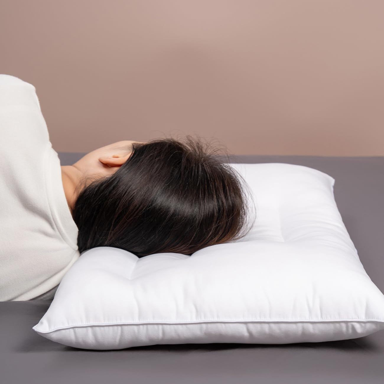 Pozino flat thin pillow close-up texture shows plush yet supportive fill.