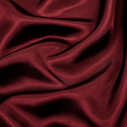 P Pothuiny burgundy satin close-up shows soft luxury finish