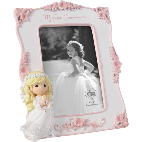 Precious Moments frame with pink flowers decor enhances any display.