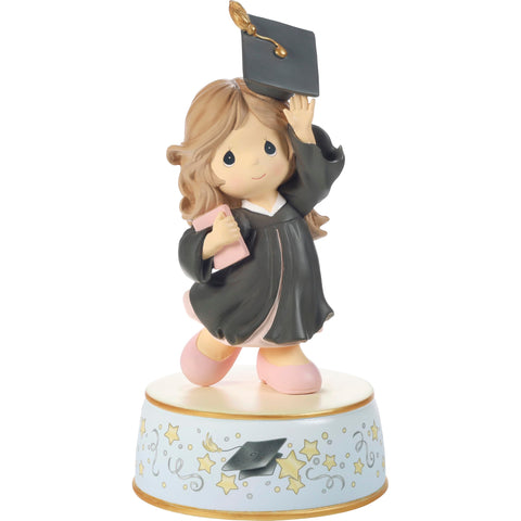 Precious Moments cap-toss graduation figurine, ideal for celebrating a graduate on display.