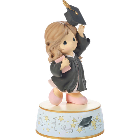 Precious Moments Pomp and Circumstance musical figure, adds a joyful musical touch to the celebration.