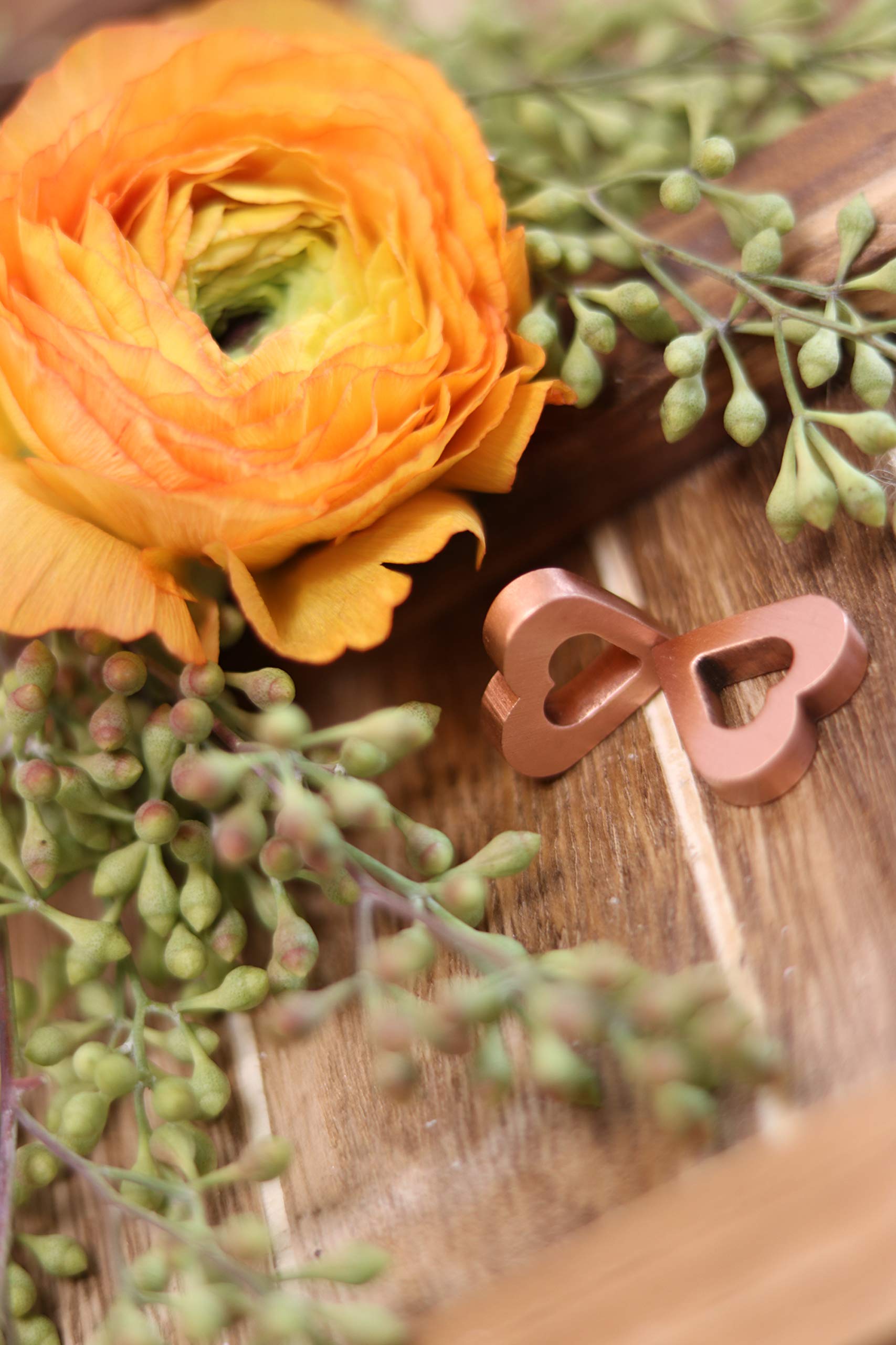 A neat vase setup featuring Precious Petal Co copper charm on the table.