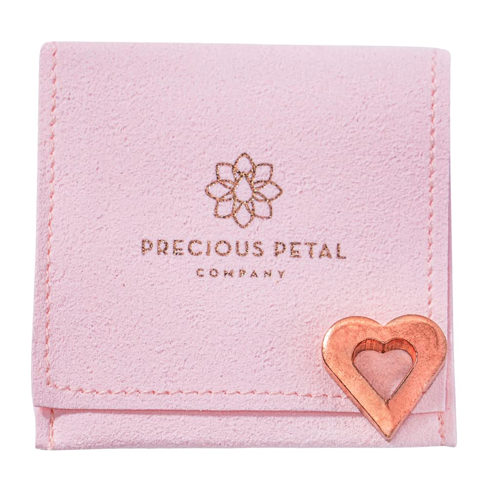 Copper charm with micro suede bag from Precious Petal Co for safe storage.
