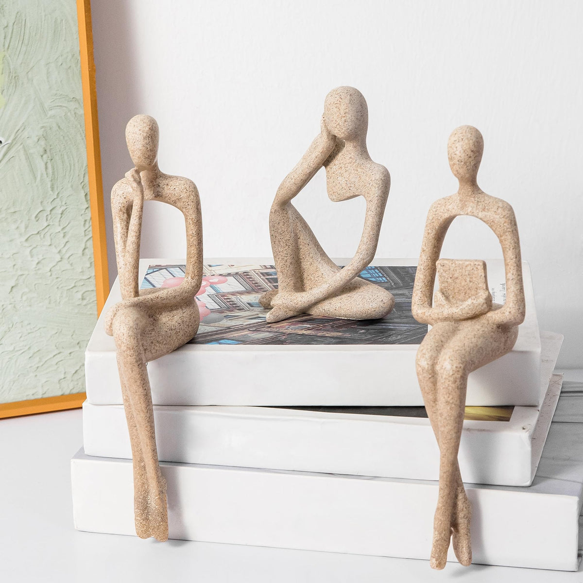 Prettidecor gold thinker statue on shelf for modern elegance
