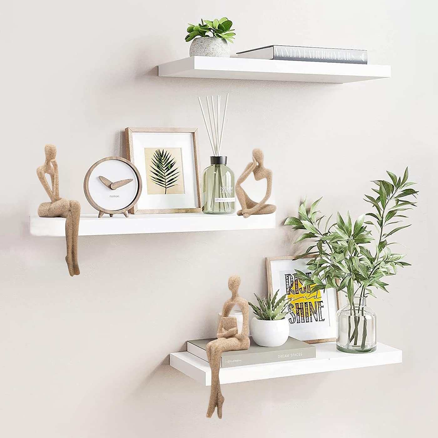 Cross-legged thinker balances a bookshelf display with style