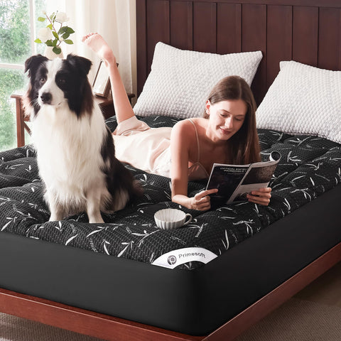 Primesoft black king-size topper shown on a neatly made bed.
