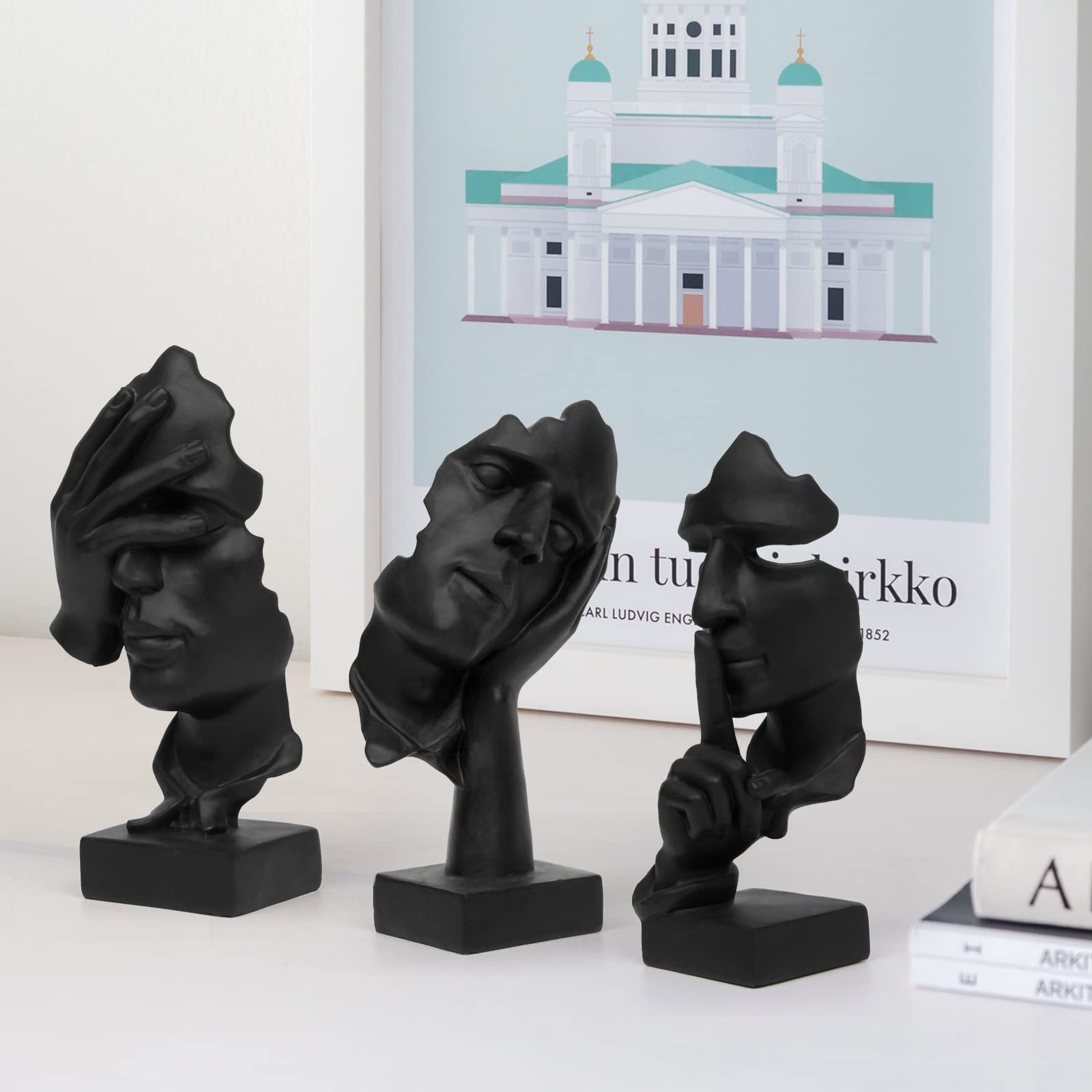Prosfalt thinker statue on office desk complements a modern workspace