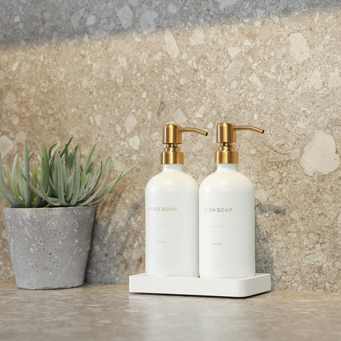 Refillable glass bottles with durable pumps by Prus Waso Gold.