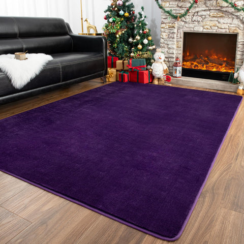 Przemy washable area rug in dark purple adds cozy bedroom comfort.