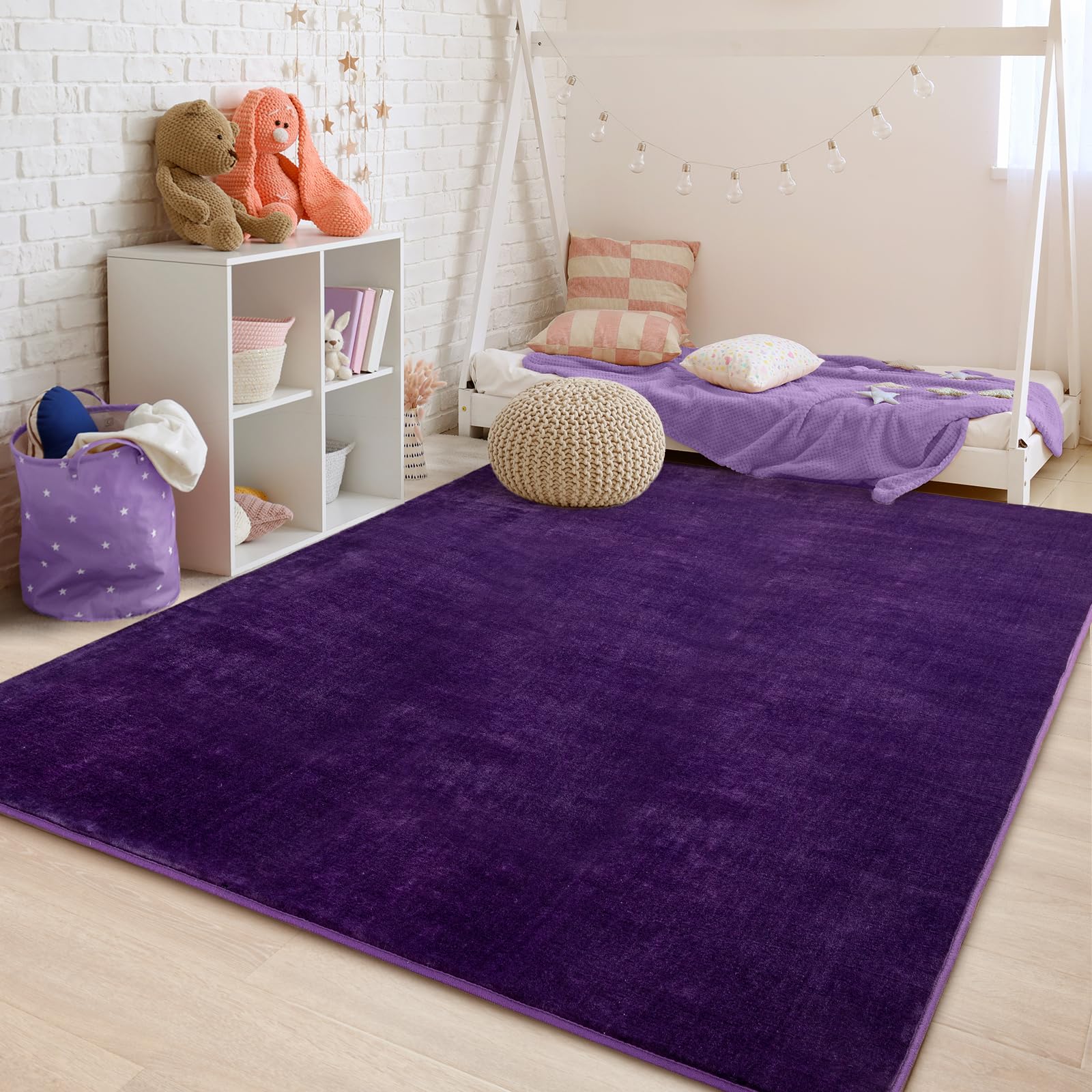 Przemy rug enhances dorm or living room decor with deep purple shade.
