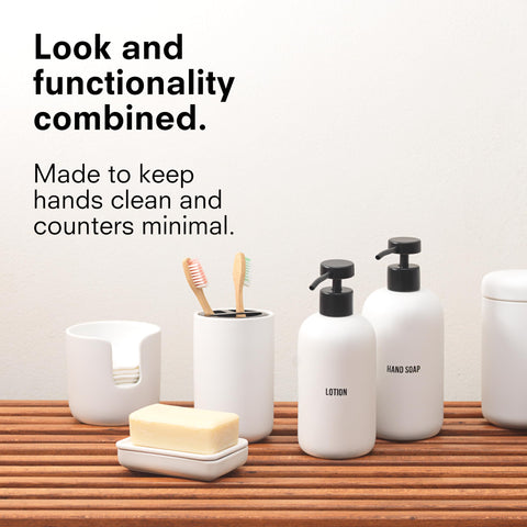 Public Goods stoneware dispenser close-up with durable stainless steel pump.