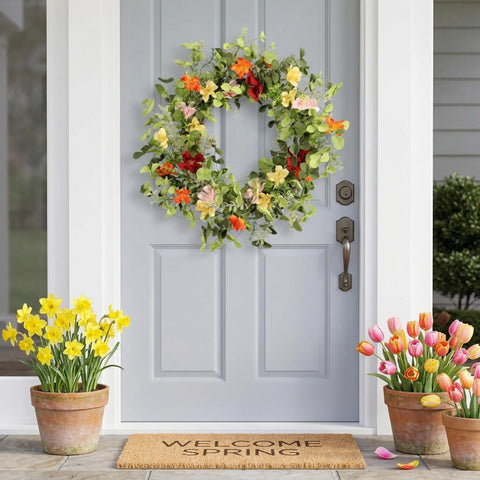 Pudate 22in wreath features berry accents for texture and warmth.