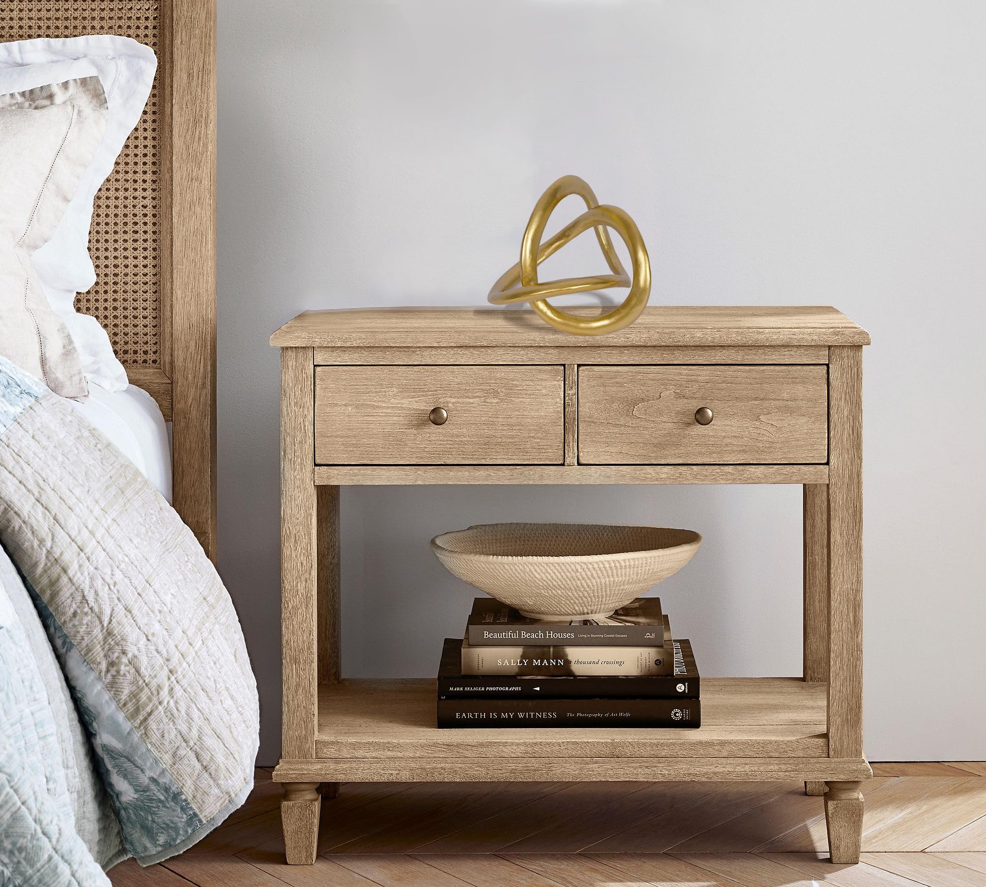 PUHOZN gold knot display on coffee table creates visual interest.