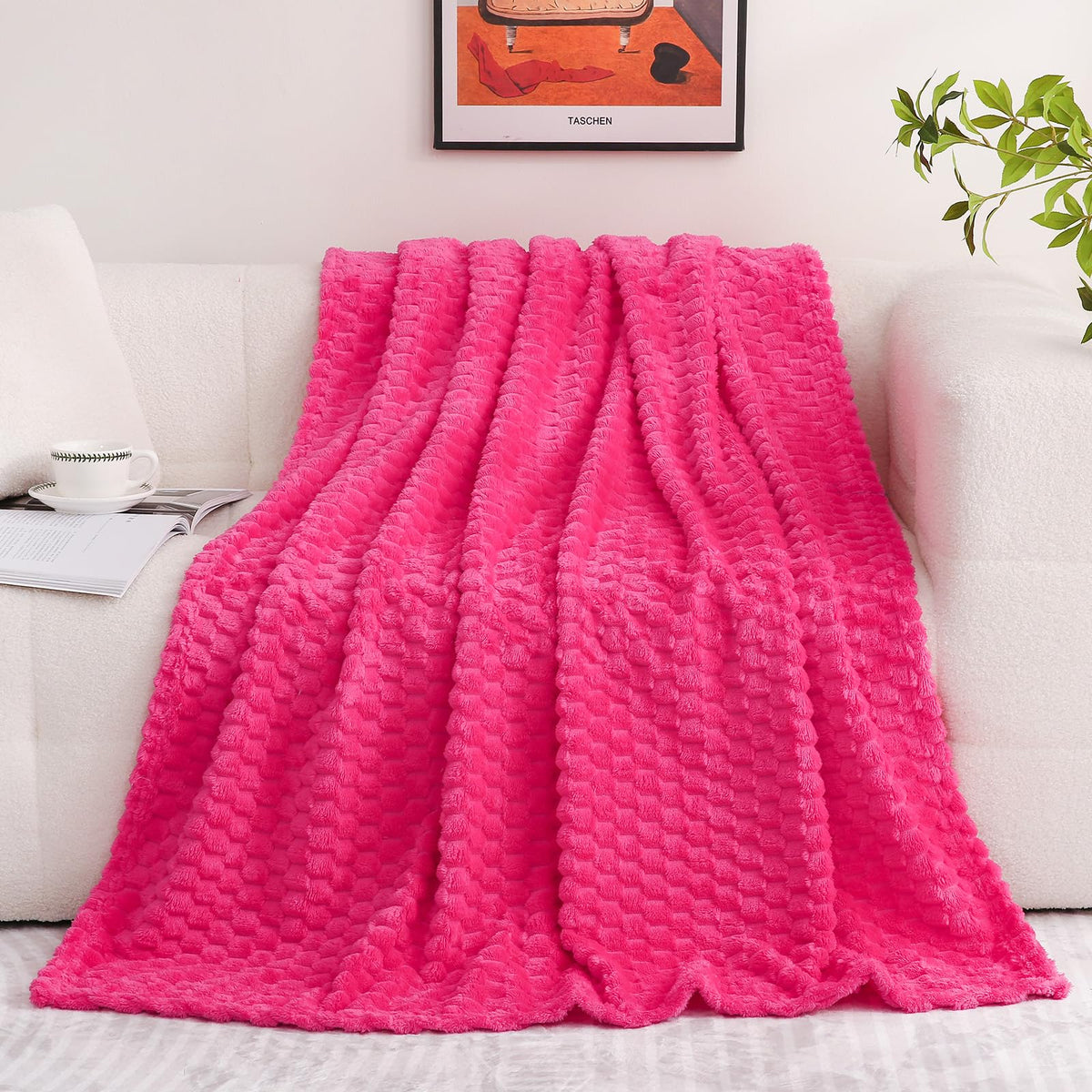 Puncuntex hot pink throw blanket close-up shows plush fleece texture and rich color.