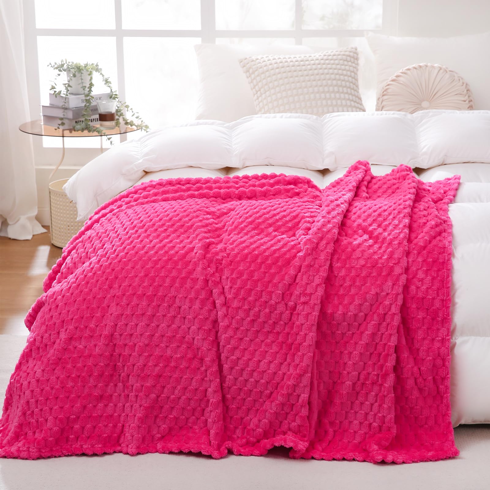 Puncuntex hot pink throw on sofa adds vibrant color and cozy comfort.
