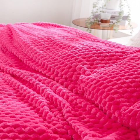 Puncuntex hot pink throw makes a gift-ready home accent.