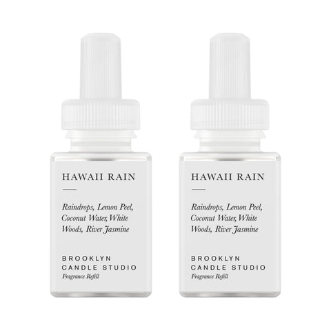 Pura Hawaii Rain refill bottle ready for Brooklyn diffuser system, showcasing long-lasting fragrance.
