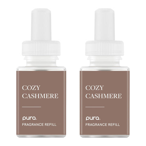 Pura Cozy Cashmere bottle showcasing warm coconut-vanilla-sandalwood notes.