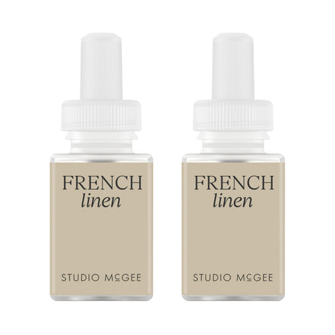 Pura Studio McGee French Linen refill bottle enhances ambiance with a calm, refined aroma.