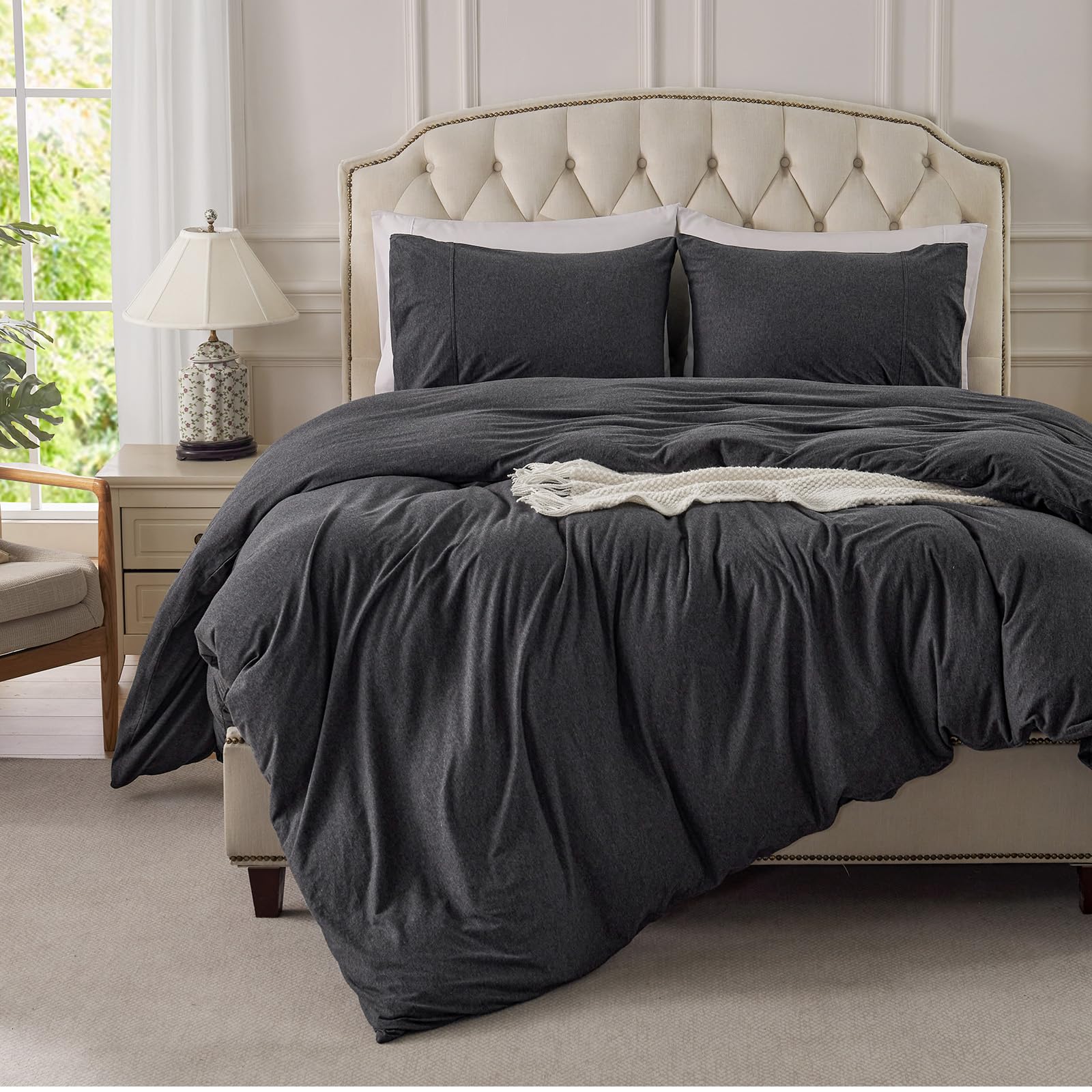 Pure Era jersey-knit pillow shams with envelope closures stay neatly tucked.