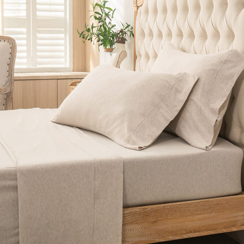 PURE ERA Jersey Knit 4pc set displayed on a bed for a cozy modern look