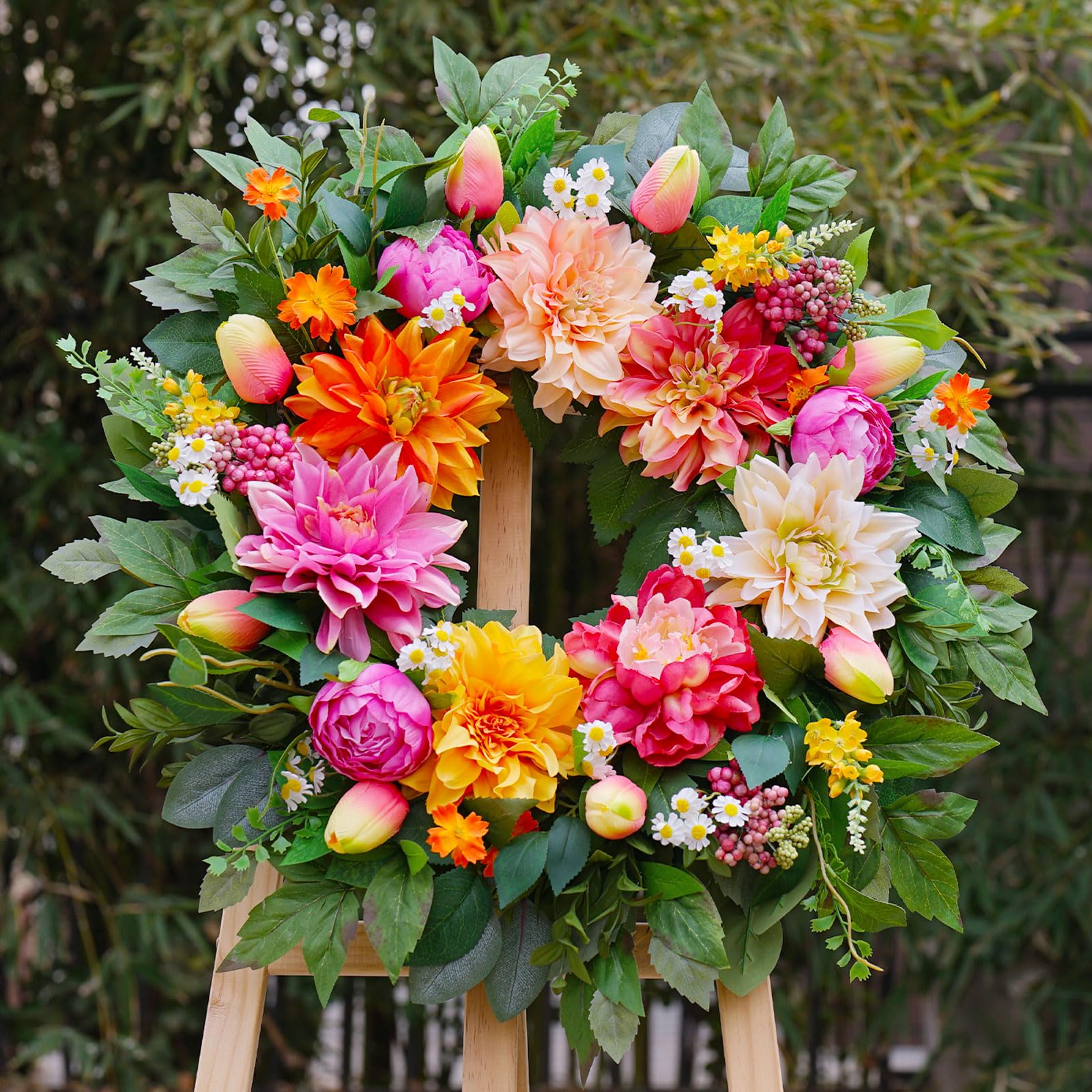 PureCosy front-door wreath closeup highlights vivid blooms and resilient materials for outdoor use.