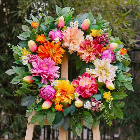 PureCosy front-door wreath closeup highlights vivid blooms and resilient materials for outdoor use.