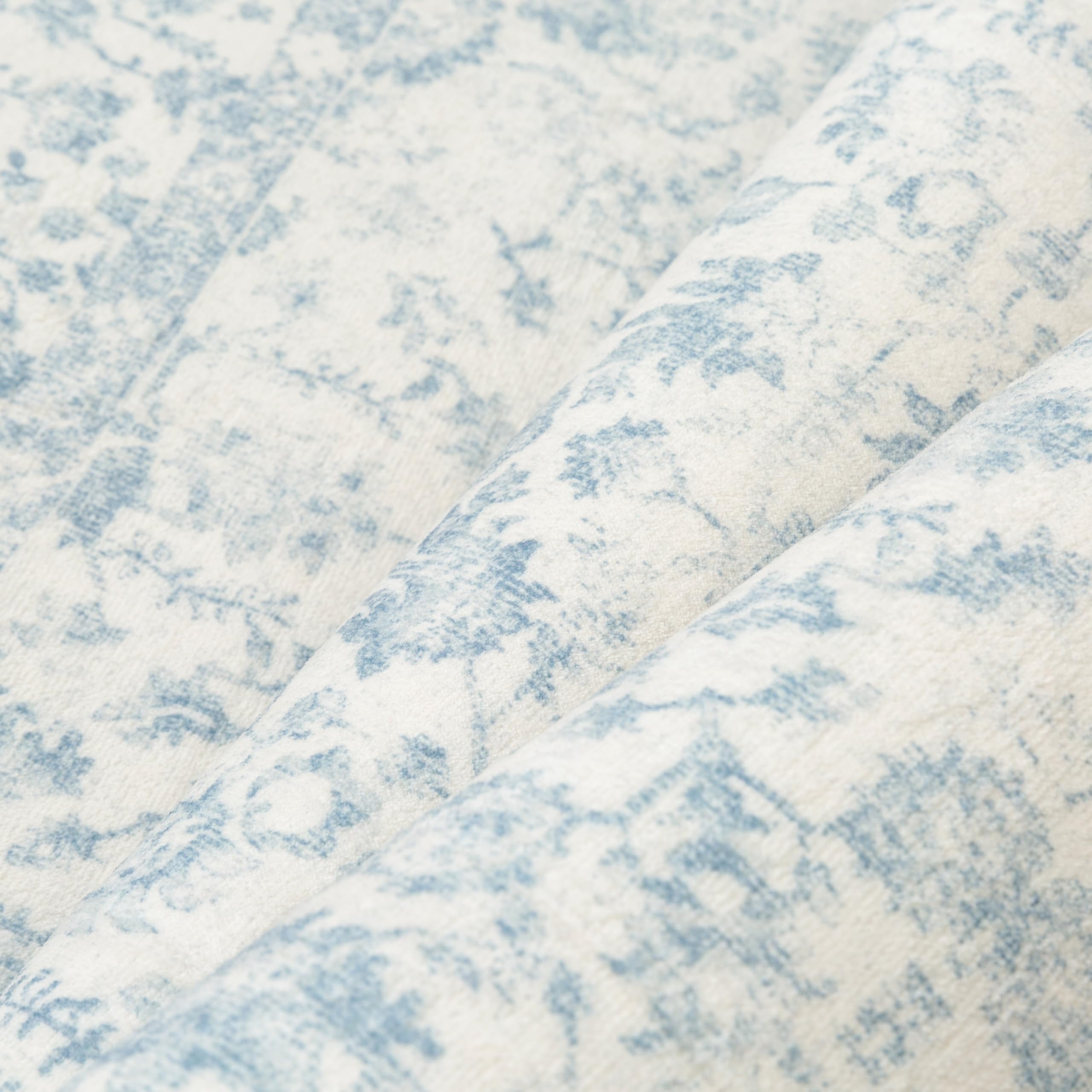 PureCozy blue rug with soft pile adds a cozy feel underfoot.