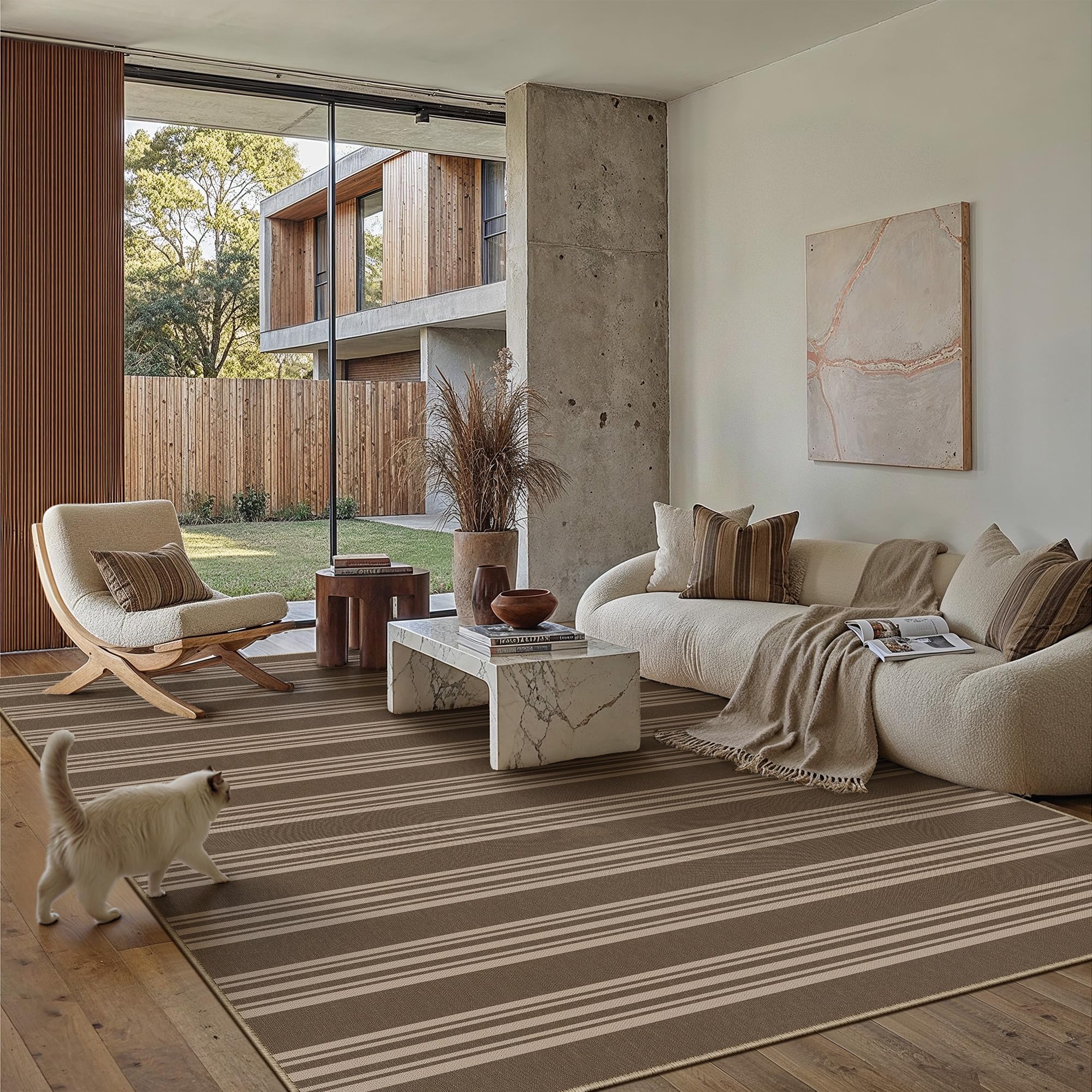 PureCozy striped easy jute 5x7 rug on outdoor patio provides slip-resistant footing and weather-friendly appeal.