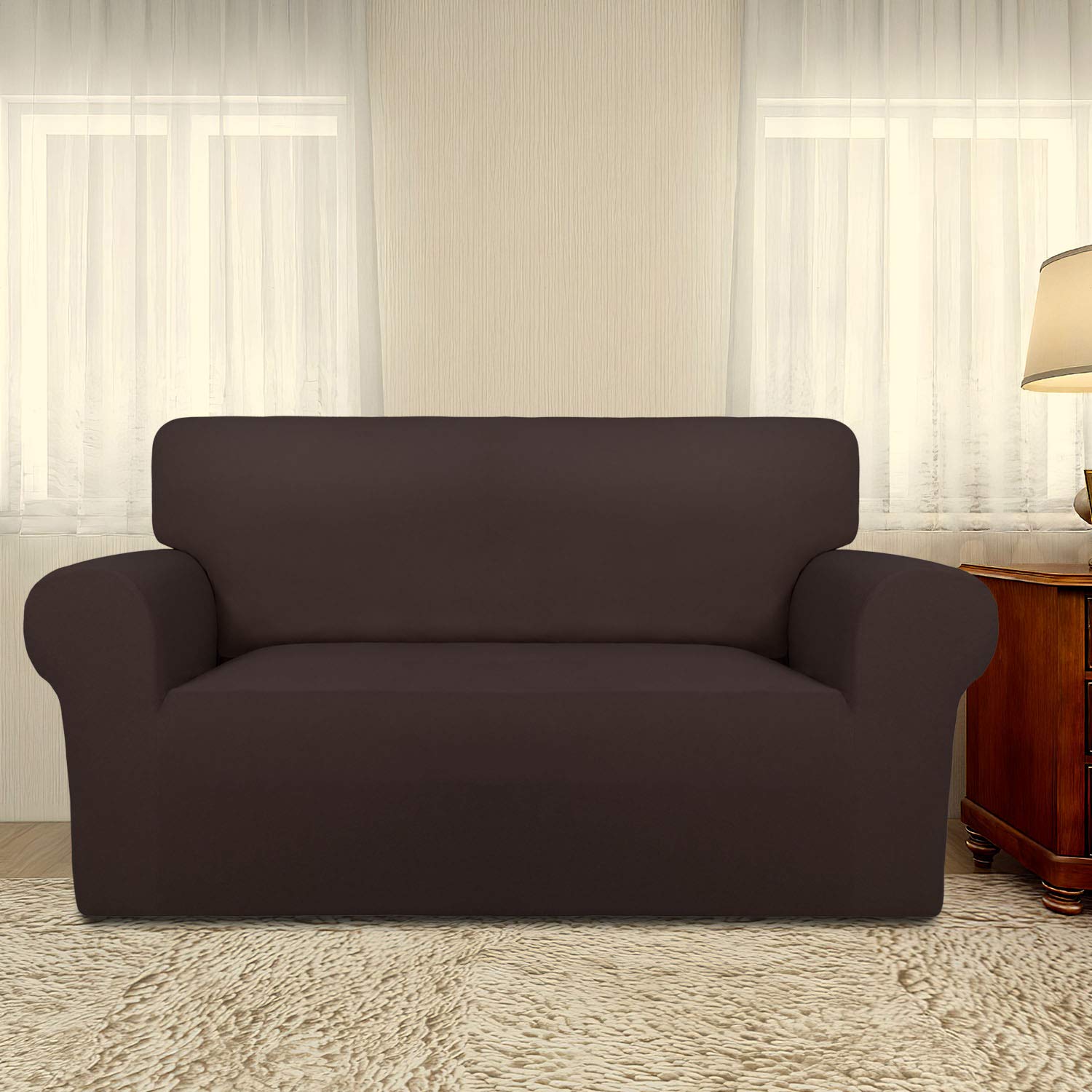 PureFit non-slip foam anchors demonstrate secure fit on a two-seater sofa