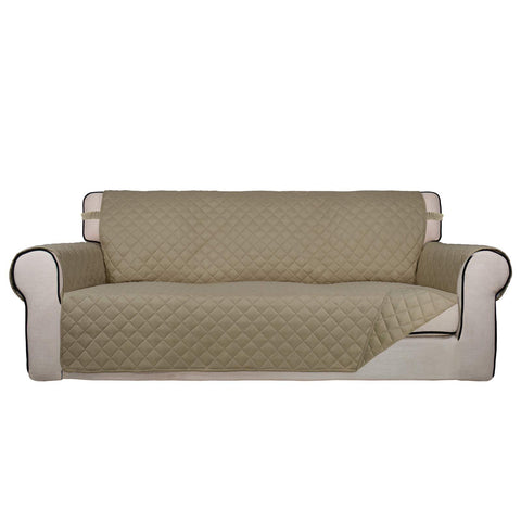 PureFit reversible quilted sofa cover top view shows soft beige fabric and plush padding.