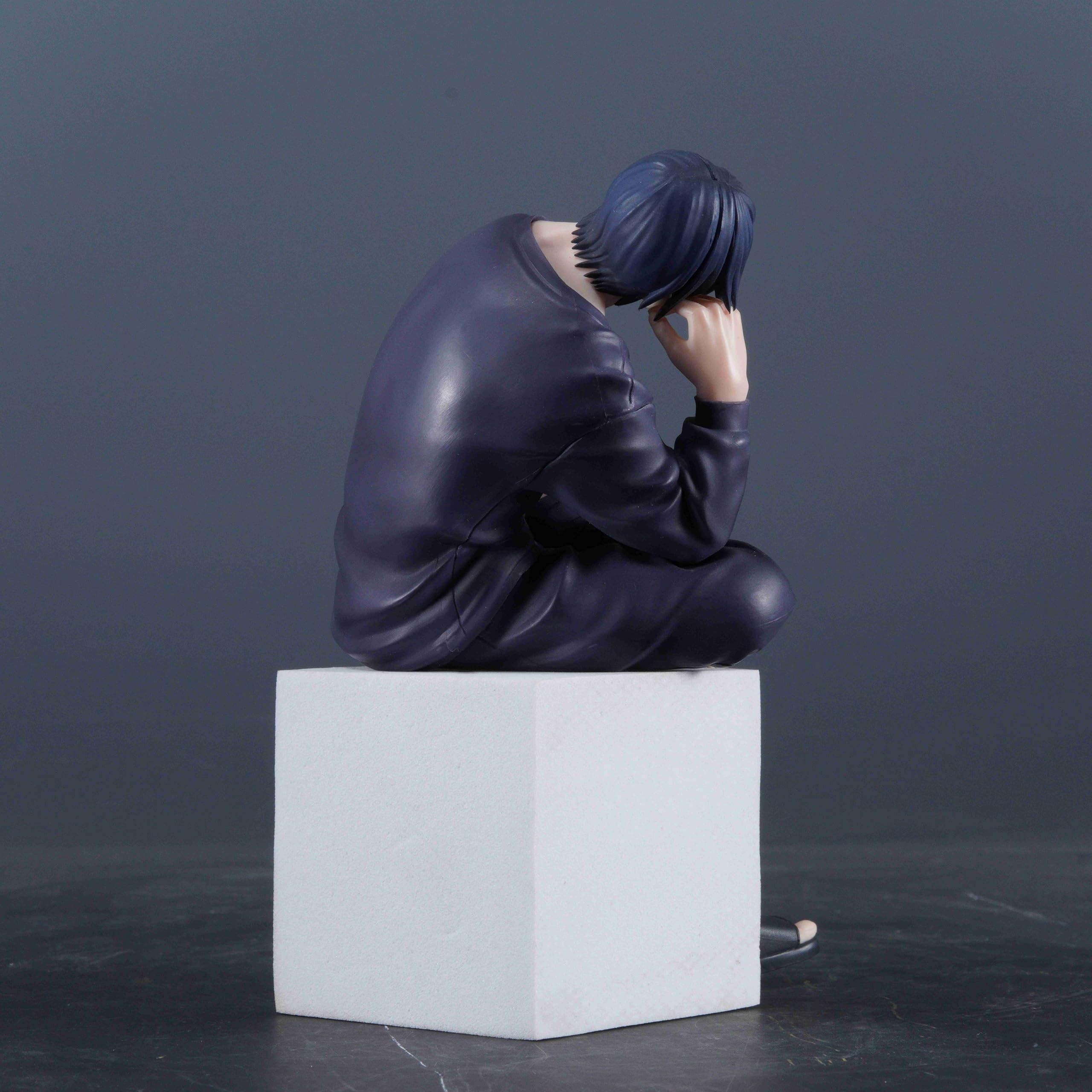 Compact 12cm figure beside a laptop enhances workspace ambiance.