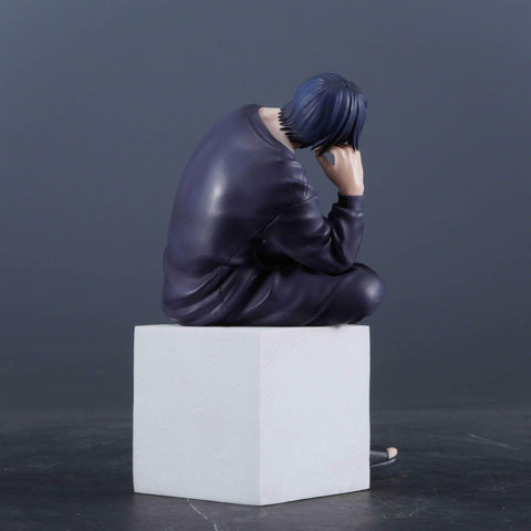 Compact 12cm figure beside a laptop enhances workspace ambiance.