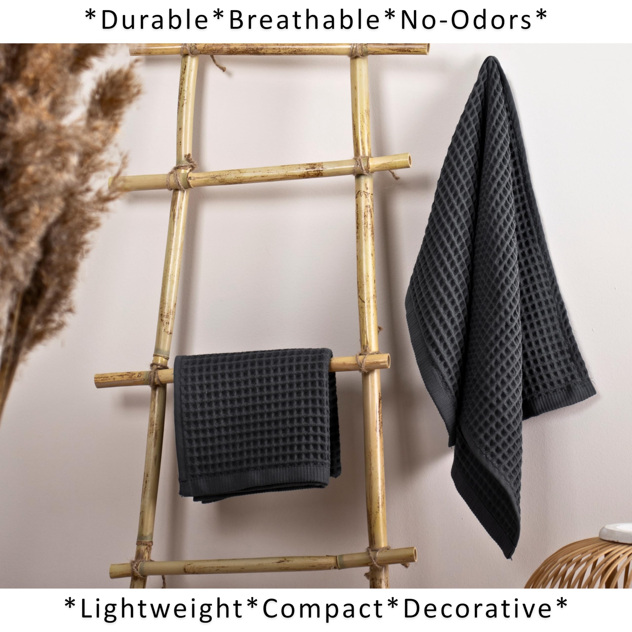 Puskul dark gray towels displayed in bathroom setting for versatile decor.