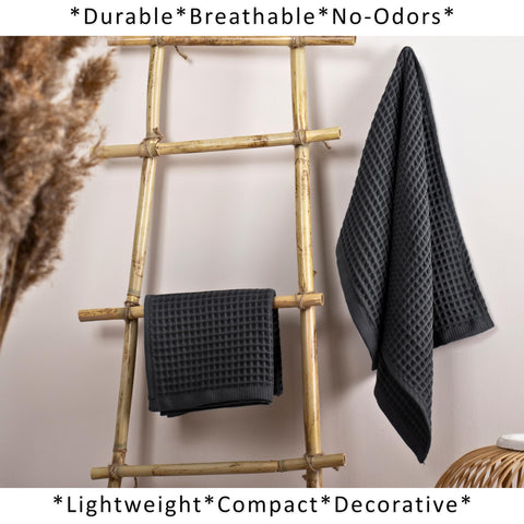 Puskul dark gray towels displayed in bathroom setting for versatile decor.