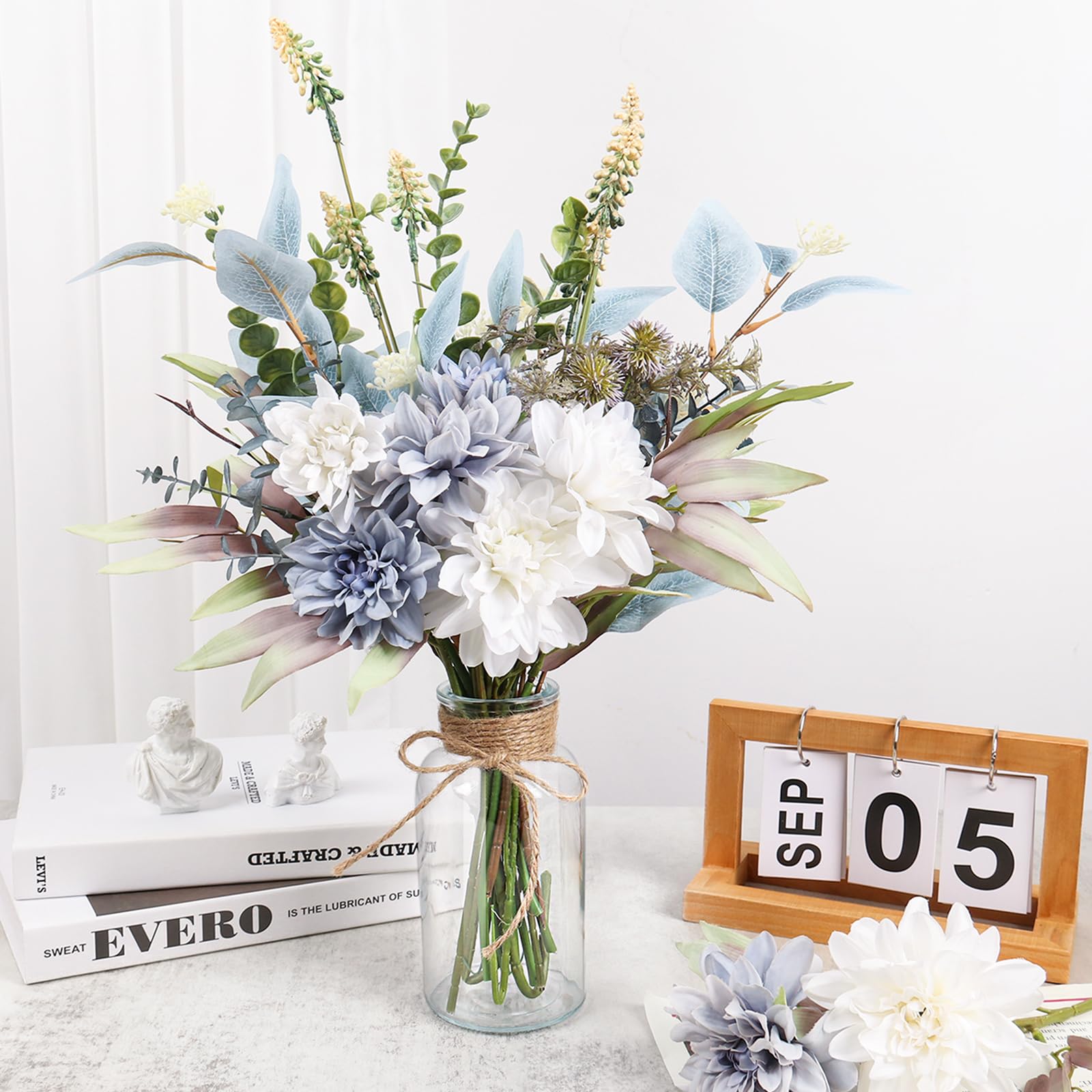 Pusuny blue dahlia arrangement adds vibrant color to coffee tables.