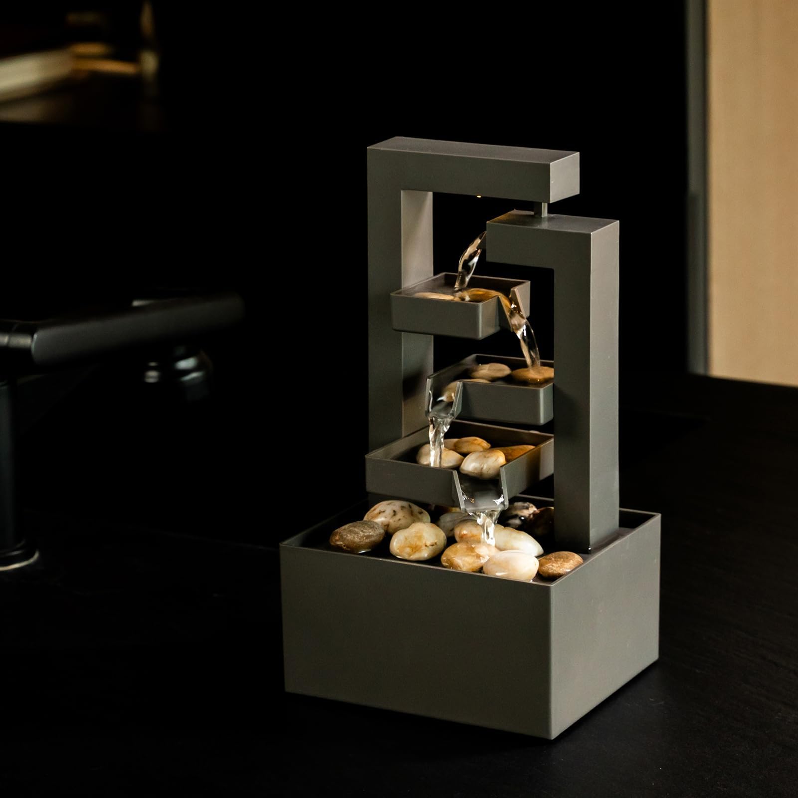 PUULYE compact desk fountain fits on a shelf or nightstand.