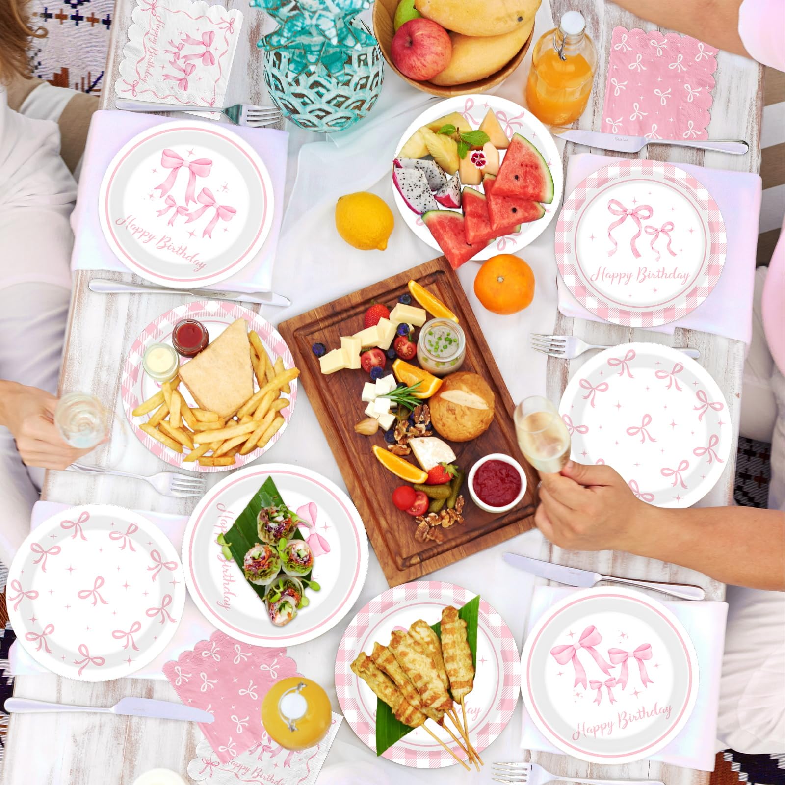 Pymurod pink bow napkins coordinating with tableware sets the scene.