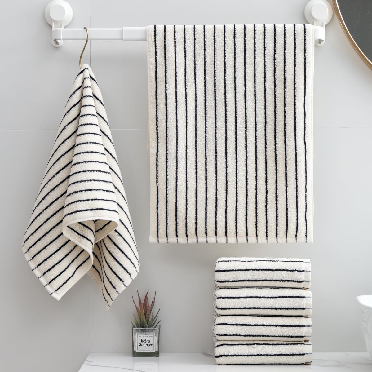 Qaxopl stripe towels in a bathroom scene emphasize plush feel and everyday absorbency.