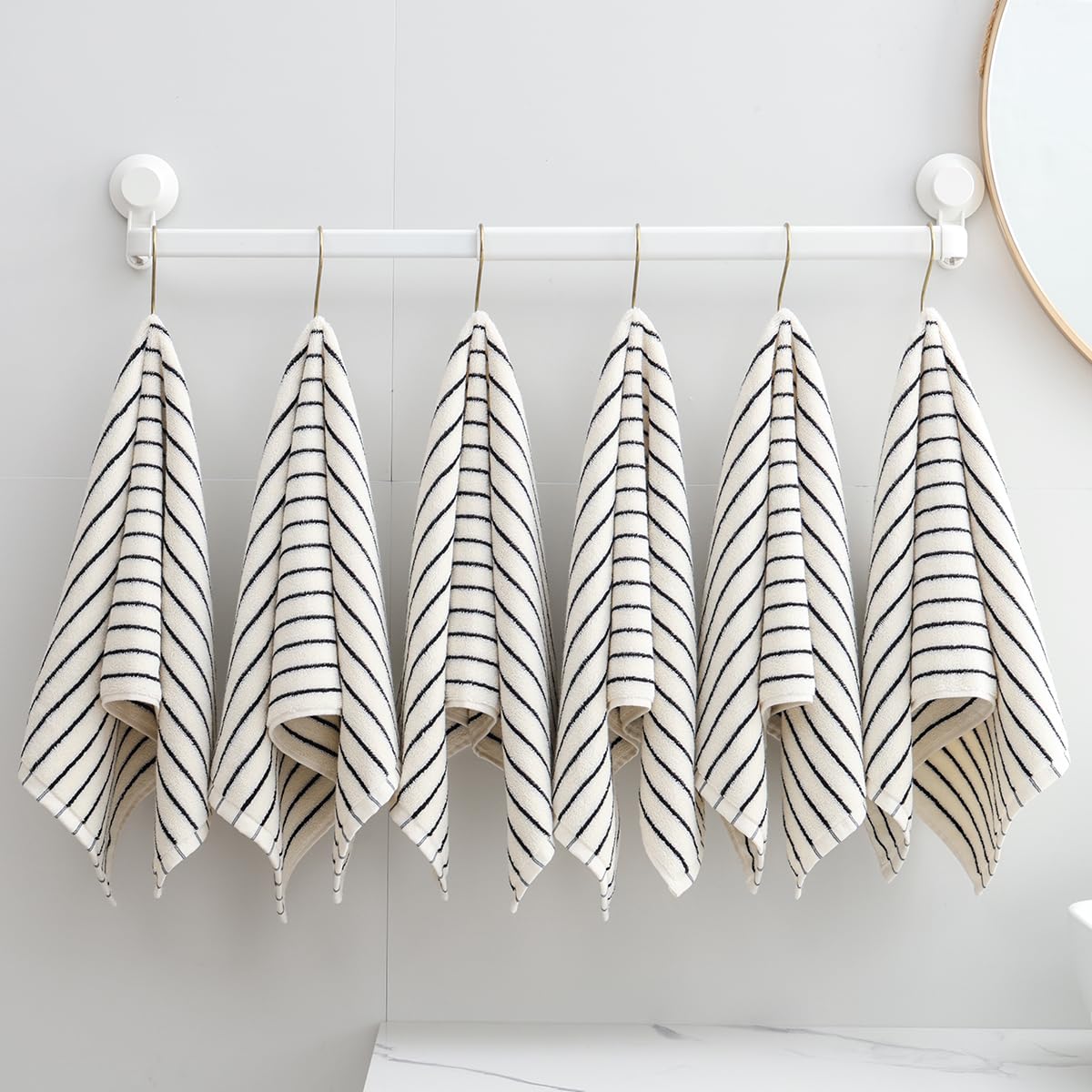 Qaxopl stripe towels in a basket convey ready-to-use organization for bathrooms and guest rooms.